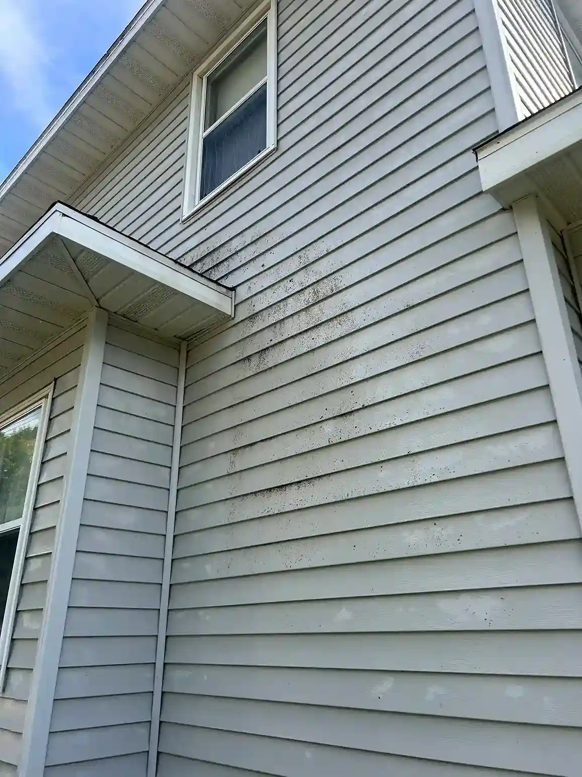 Complete exterior home wash finish leaving siding bright and clean