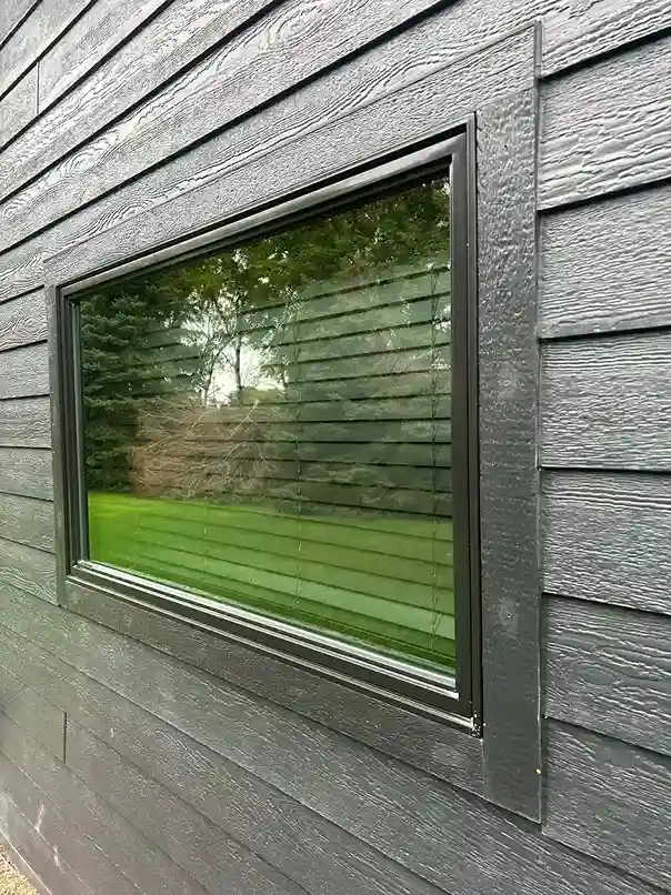 Sprinkler hard water mineral stain removal from exterior window glass